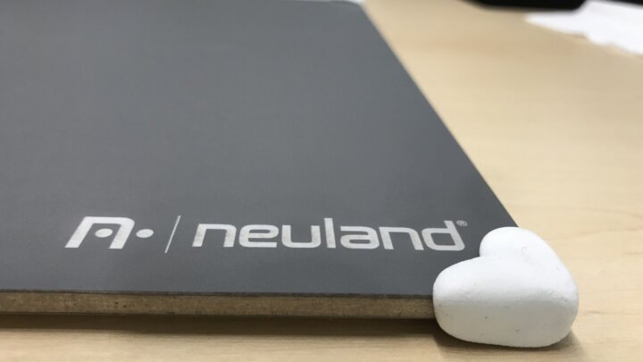Close-up of a rounded white Sugru corner covering the edge of the myWorkBoard WB