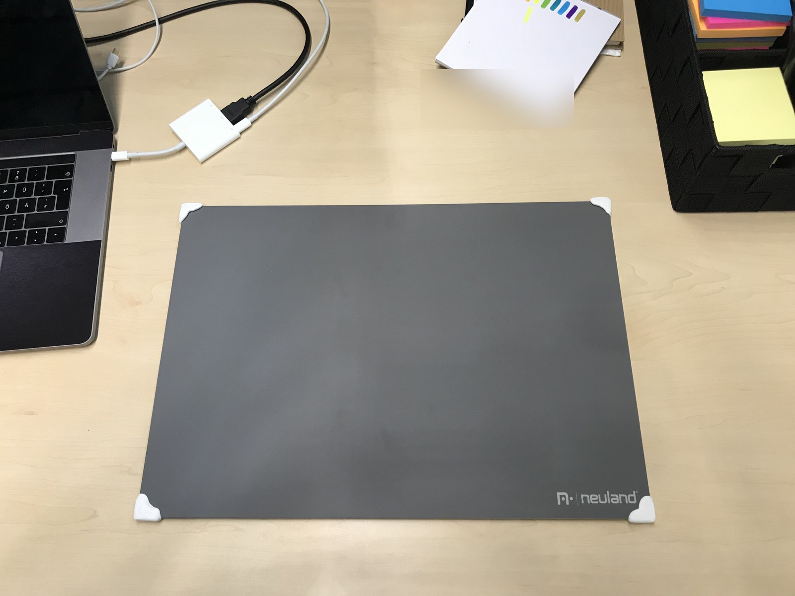 Grey reverse of the board, showing the white Sugru wrapped around its corners