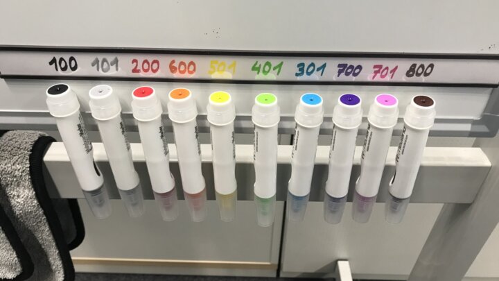 Ten markers hanging beneath a strip of matching color-number labels.