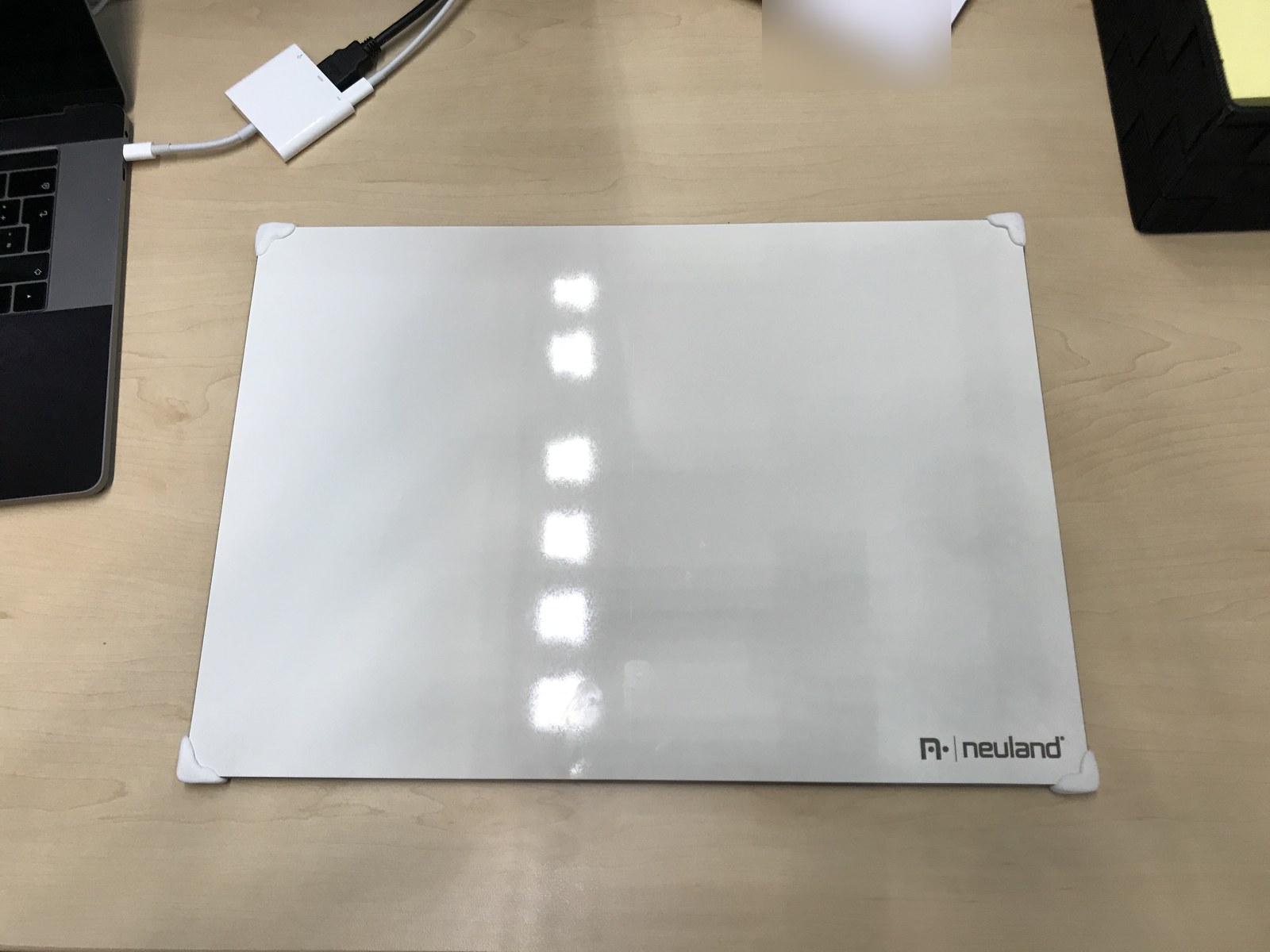 White face of a Neuland myWorkBoard WB with white Sugru covering its corners